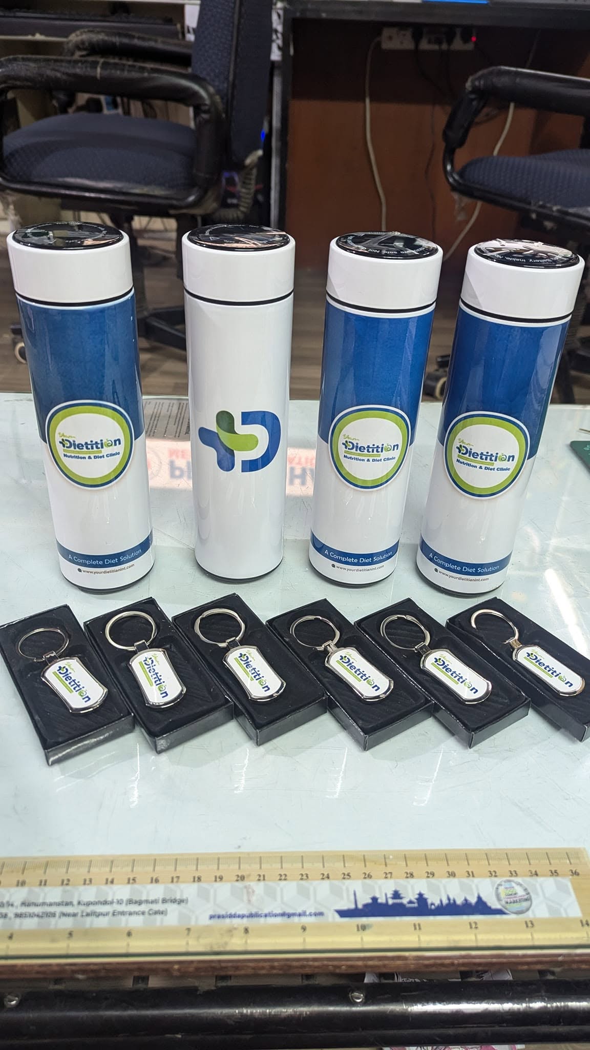 Matching branded bottles and keyrings for a client